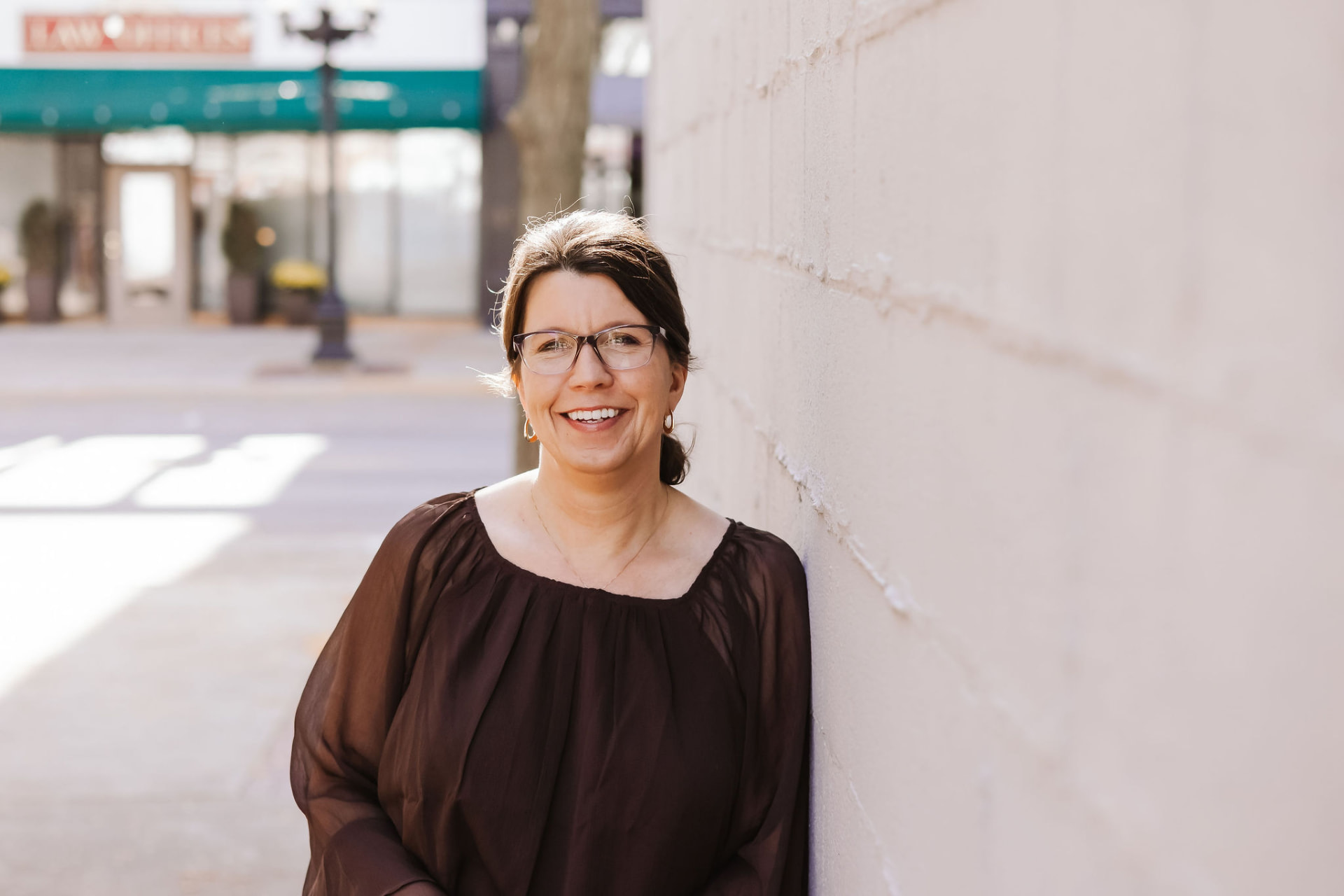 Lori Rasmussen, LISW, smiling outdoors in natural light