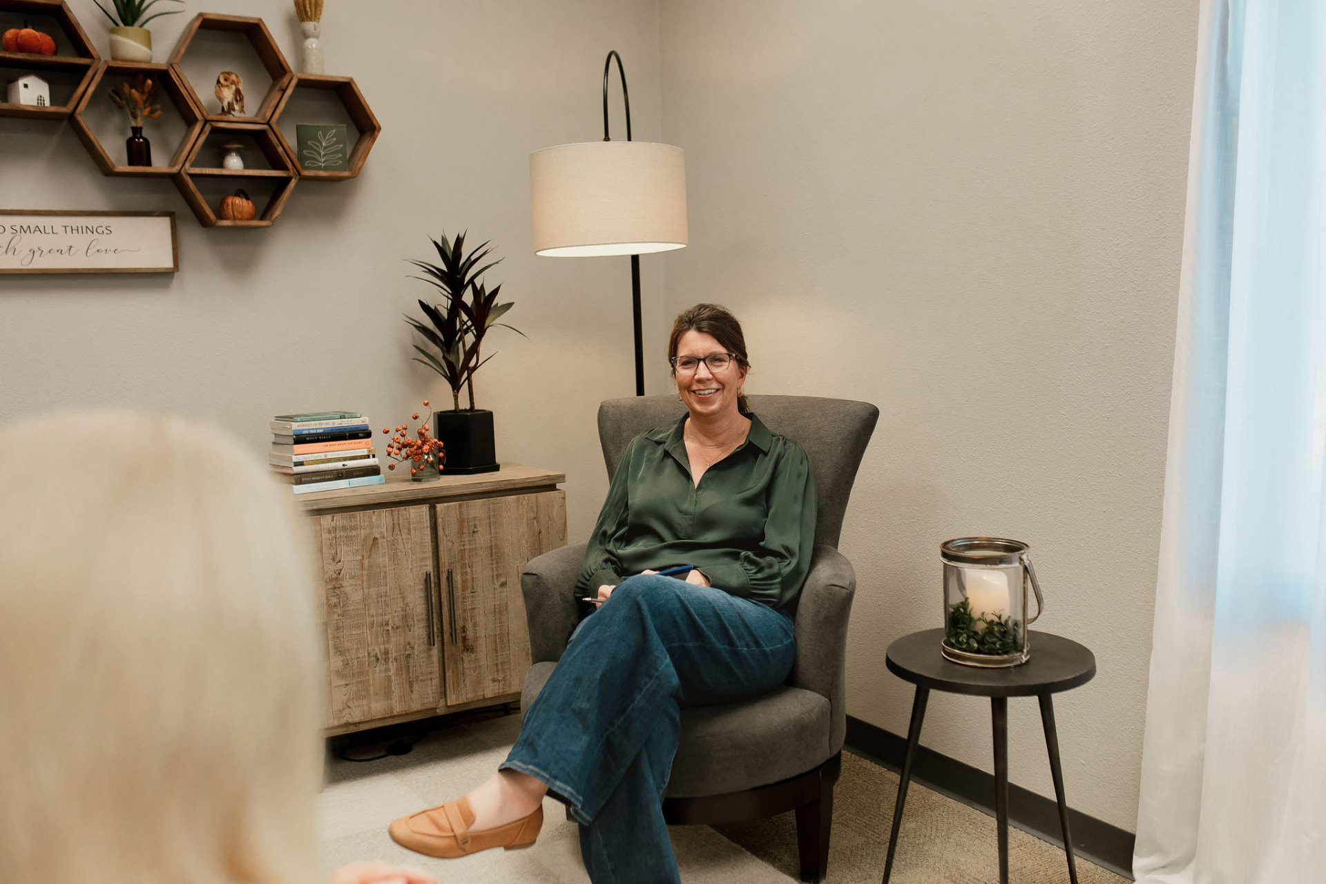 Lori Rasmussen's counseling office in Waterloo, Iowa, with soft natural light and comfortable seating